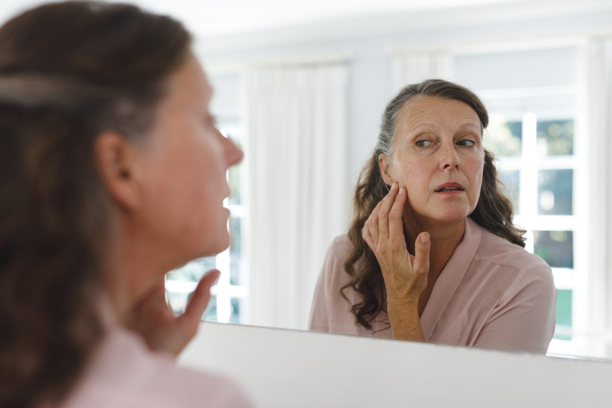 senior caucasian woman in bathroom looking at her 2022 01 18 23 46 15 utc scaled - Facial Contouring & Skin Tightening